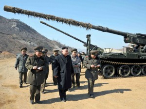 This undated picture released by North Korea's official Korean Central News Agency on March 12, 2013 shows North Korean leader Kim Jong Un (C) inspecting a long-range artillery sub-unit of Korean People's Army Unit 641 at undisclosed place in North Korea.   AFP / Getty Images / KCNA via KNS