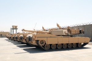 M1A1 Abrams tanks sit parked at a secured compound at the Besmaya Combat Training Center. The last shipment of M1A1 Abrams tanks arrived mid-August completing the Government of Iraq's purchase of 140 tanks through a Foreign Military Sales agreement with the United States.  — Photo by Army Staff Sgt. Edward Daileg